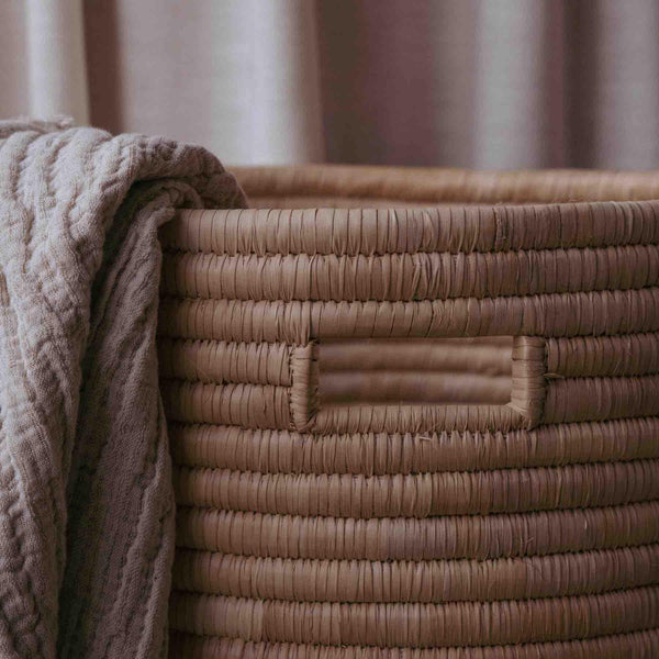 rattan ikea laundry basket with blankets
