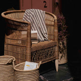 Traditional outdoor Malawi rattan cane chair with baskets in Dubai