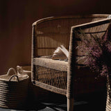 Traditional indoor Malawi rattan cane chair with baskets in Dubai
