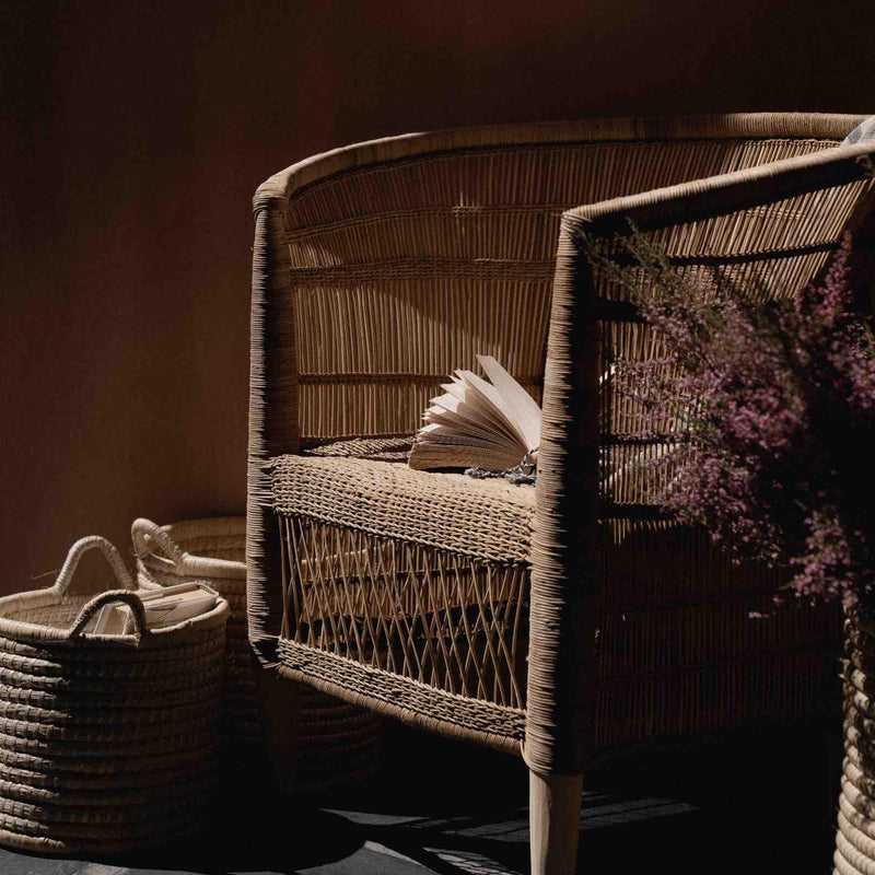Traditional indoor Malawi rattan cane chair with baskets in Dubai
