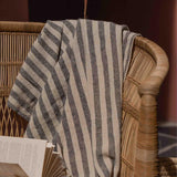 Traditional indoor Malawi rattan cane chair with blanket in Dubai