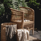 Traditional outdoor Malawi rattan cane chair with baskets in Dubai